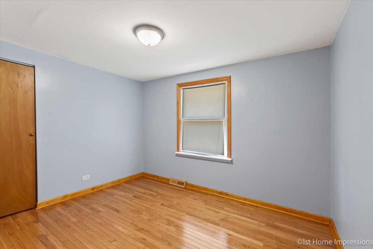 16640 Marshfield Avenue Markham, IL 60428 - Photo 12 of 20 a view of empty room with wooden floor