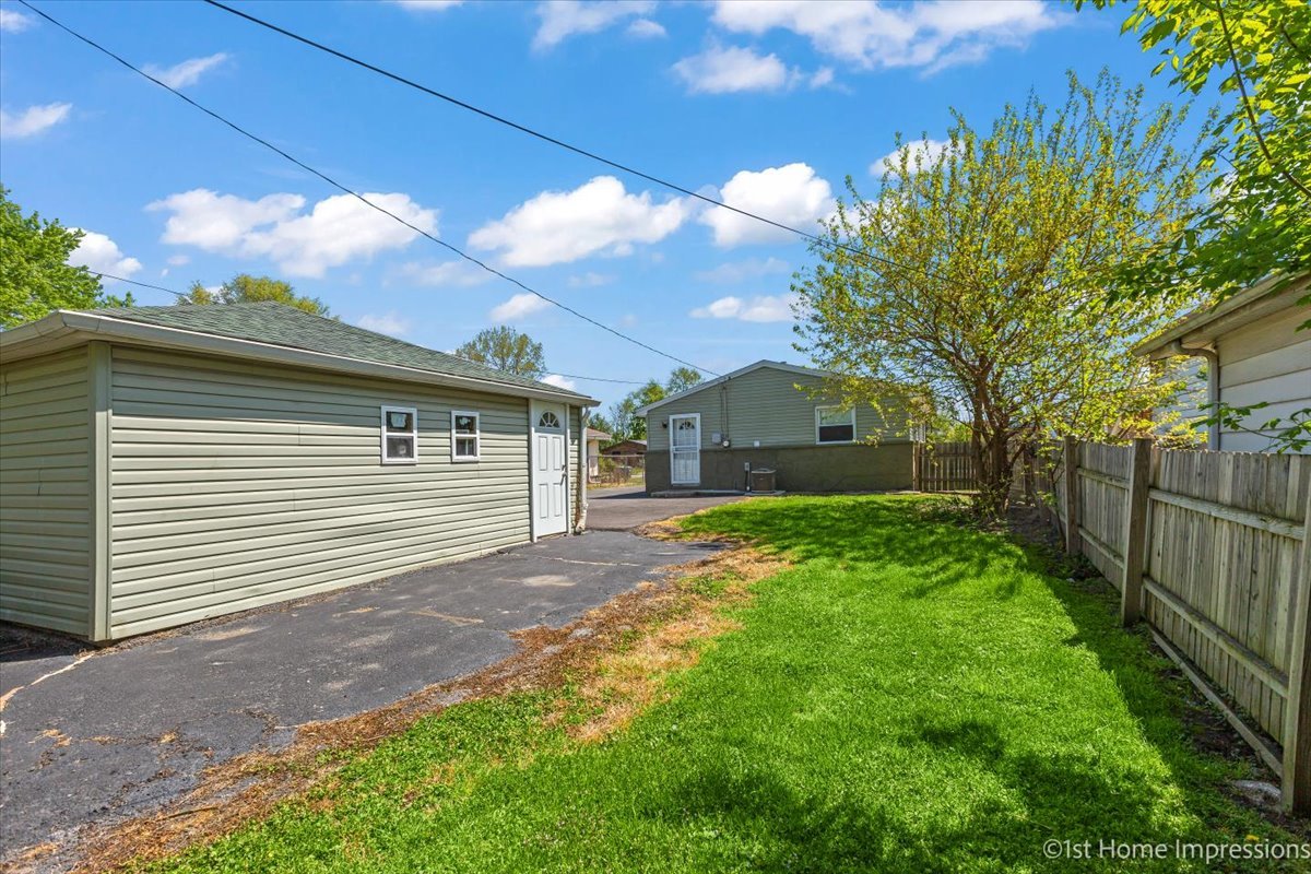 16640 Marshfield Avenue Markham, IL 60428 - Photo 19 of 20 a view of a house with a yard