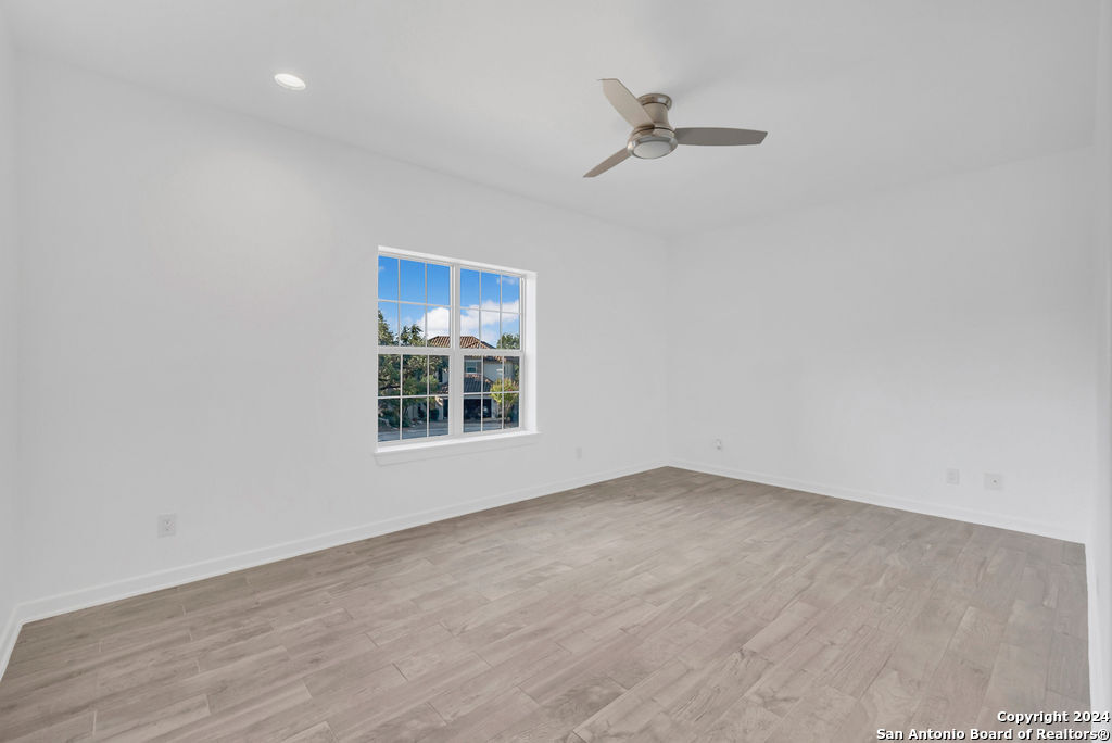 1303 Summerfield San Antonio, TX 78258 - Photo 21 of 27 an empty room with a empty space and windows