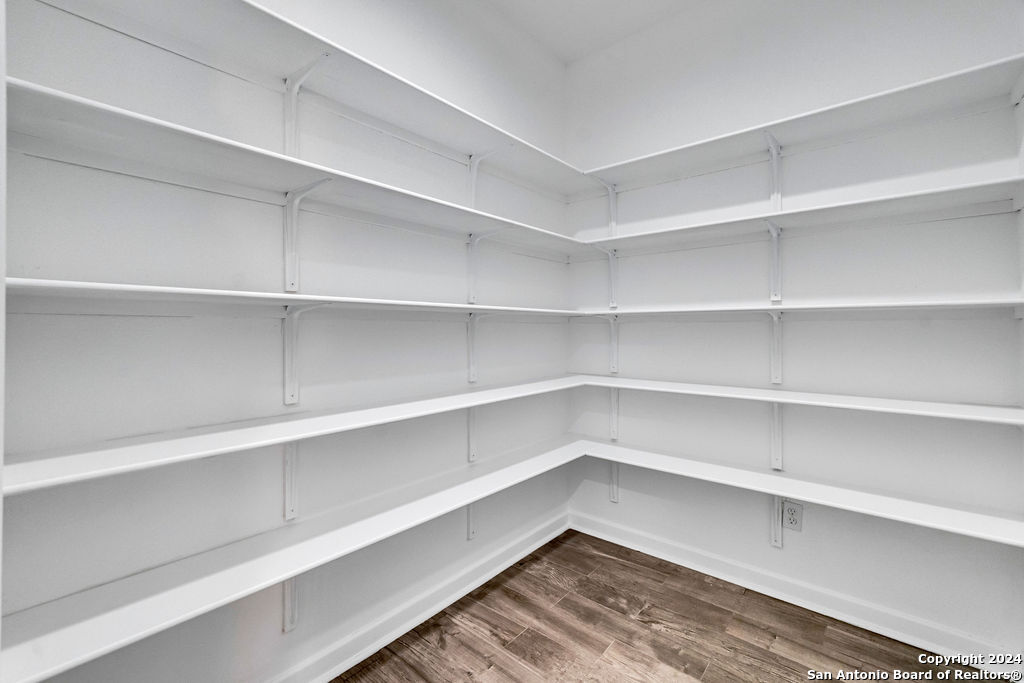 1303 Summerfield San Antonio, TX 78258 - Photo 24 of 27 a view of walk in closet with empty racks