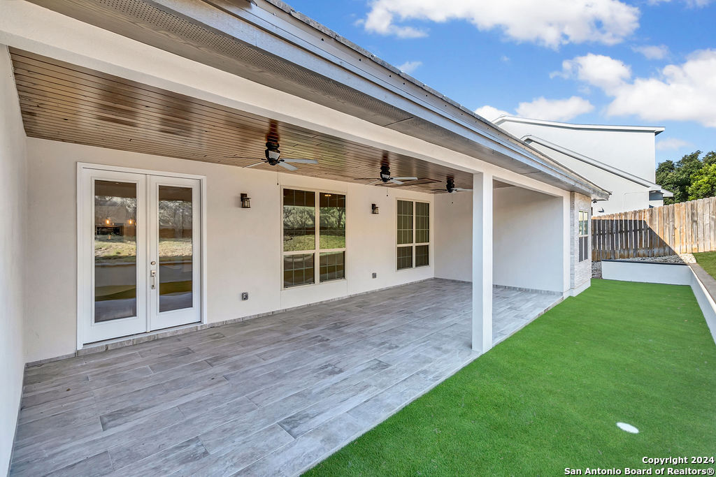 1303 Summerfield San Antonio, TX 78258 - Photo 27 of 27 a view of a backyard with plants and wooden fence