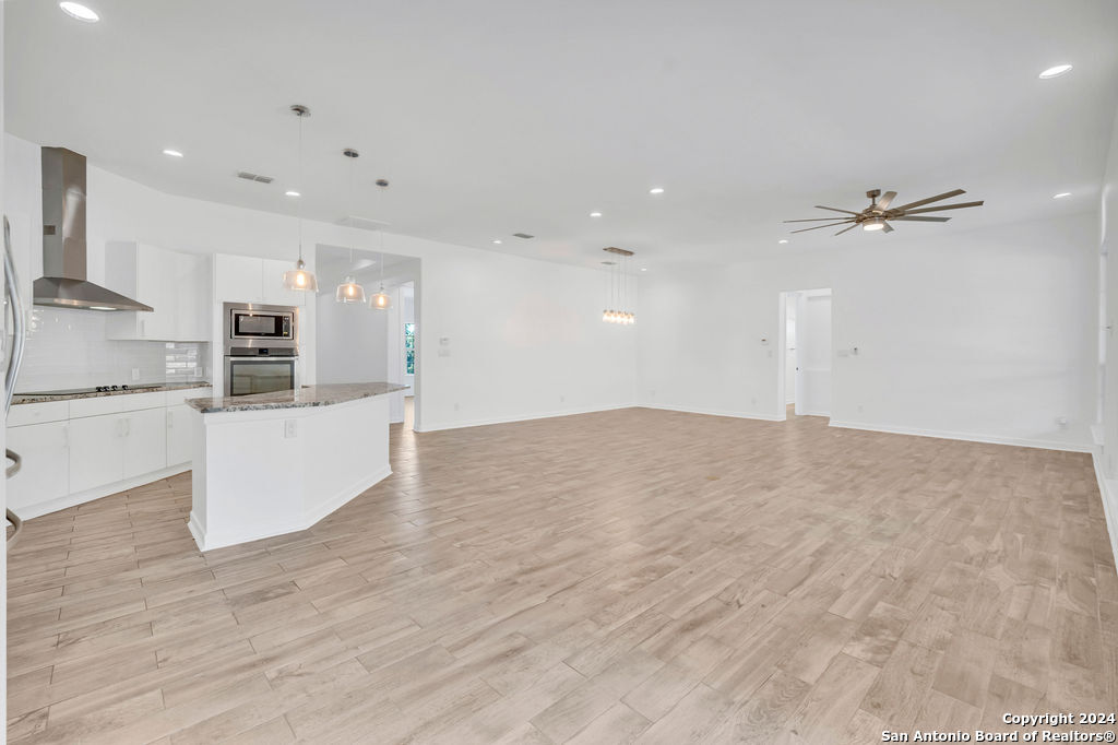 1303 Summerfield San Antonio, TX 78258 - Photo 9 of 27 a view of a kitchen with a sink and a refrigerator