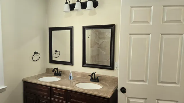 a bathroom with a sink and a mirror