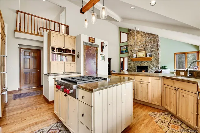 a kitchen with stainless steel appliances granite countertop a stove and a sink