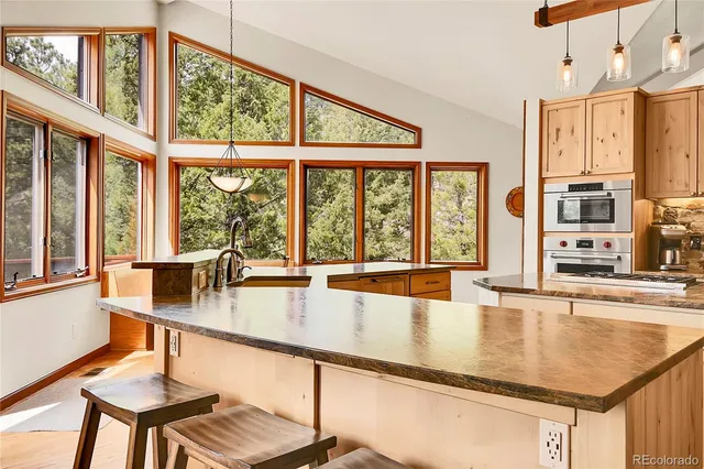 a dining room with large window