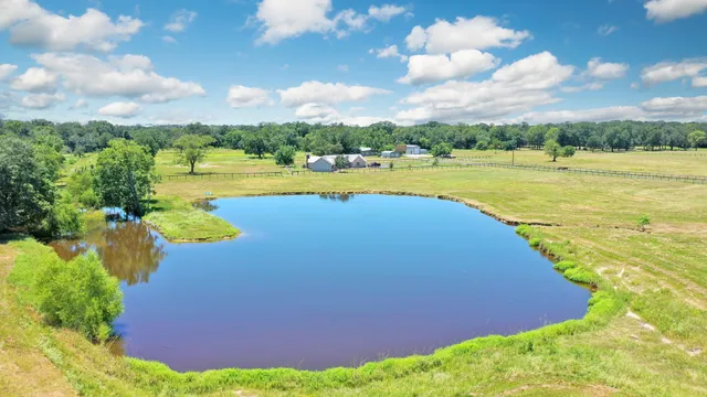 a view of a lake with a house in the background
