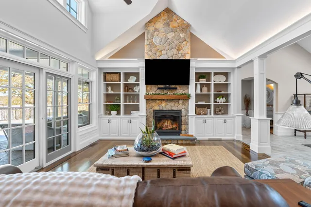 a kitchen with lots of counter and chairs