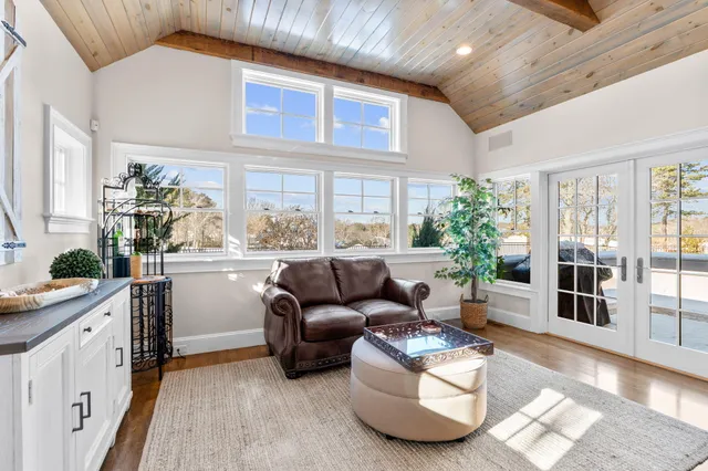 a living room with furniture and closet