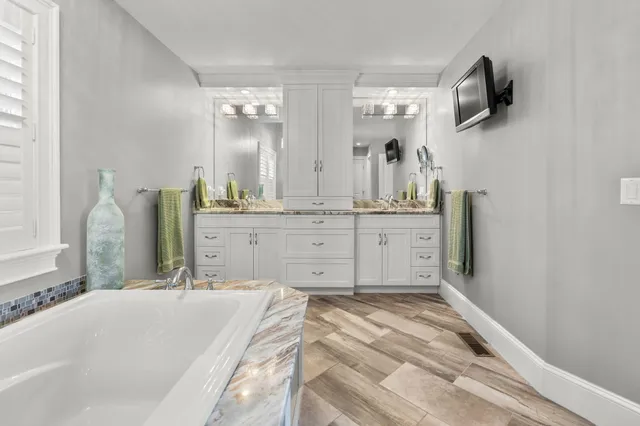 a bedroom with a bed and a lamp on table