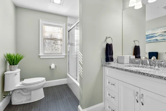 a view of a house with sitting area and garden