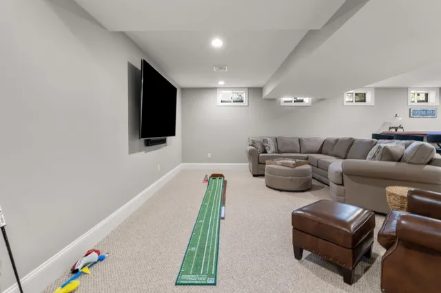 a picture of a room with a white wall and a picture