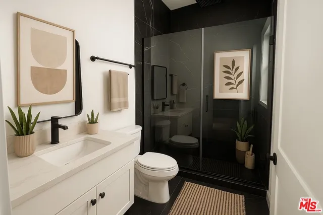 a bathroom with a sink a toilet and shower