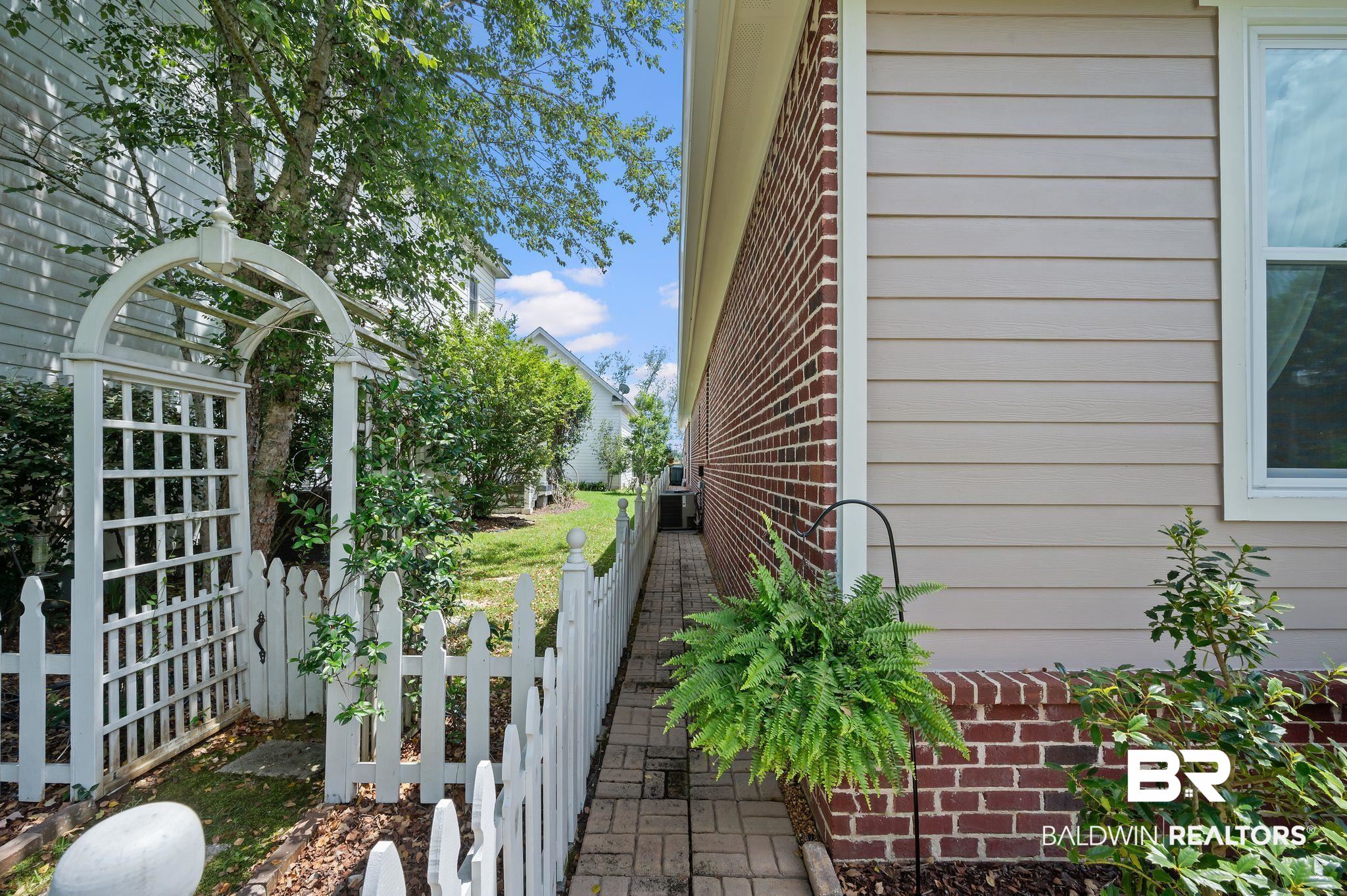 905 Buttercup Lane Foley, AL 36535 - Photo 4 of 47 View of home's exterior featuring brick siding