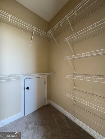 a view of a room with racks on the wall