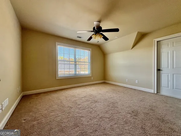 a view of empty room with windows
