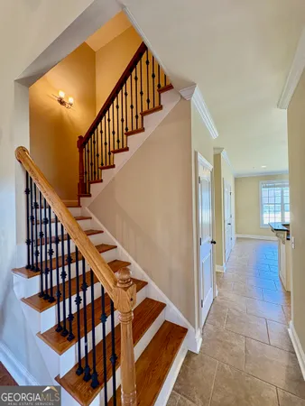 a view of entryway and hall with wooden floor
