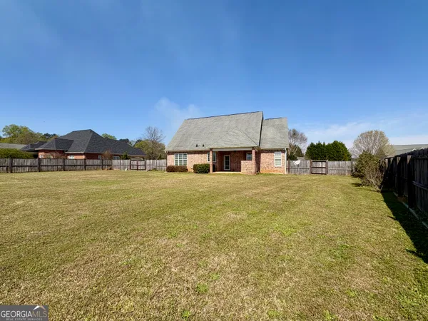 a front view of house with yard and seating