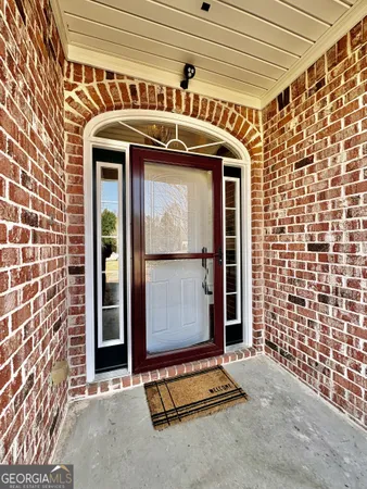 a front view of a building with a couple of windows