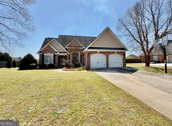 a front view of a house with a yard