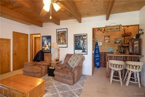 a living room with furniture a table and chairs