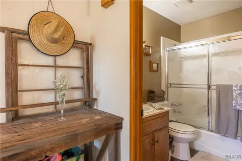 a bathroom with a toilet a sink and a mirror