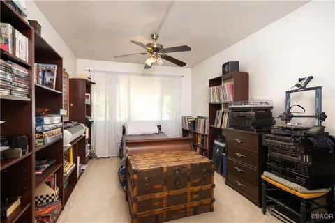 a bedroom with a bed and flat screen tv