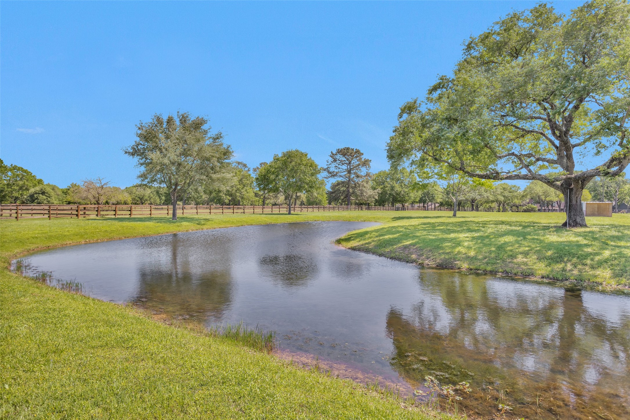 Tbd Walker Lane Fulshear, TX 77406 - Photo 13 of 17 a view of a lake with a yard