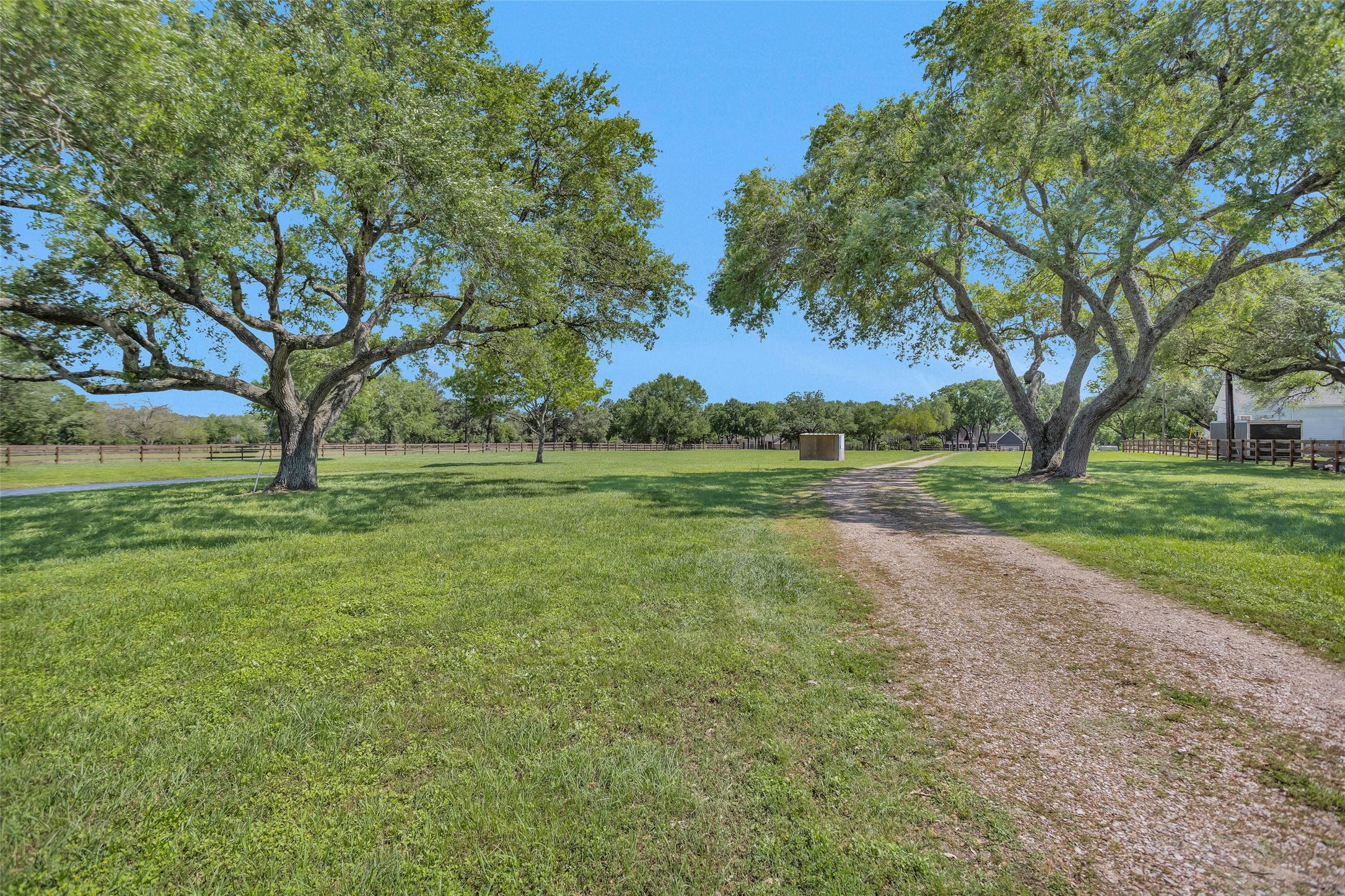 Tbd Walker Lane Fulshear, TX 77406 - Photo 4 of 17 a view of outdoor space with green field and trees