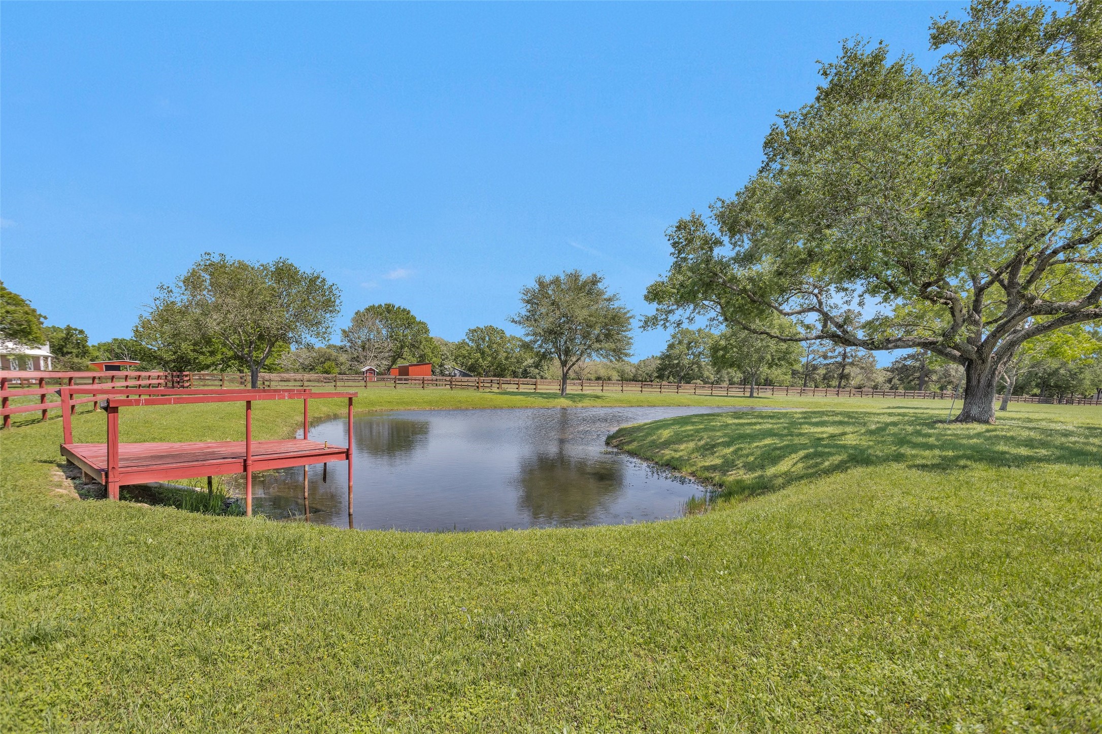 Tbd Walker Lane Fulshear, TX 77406 - Photo 5 of 17 a view of a lake with houses in the back