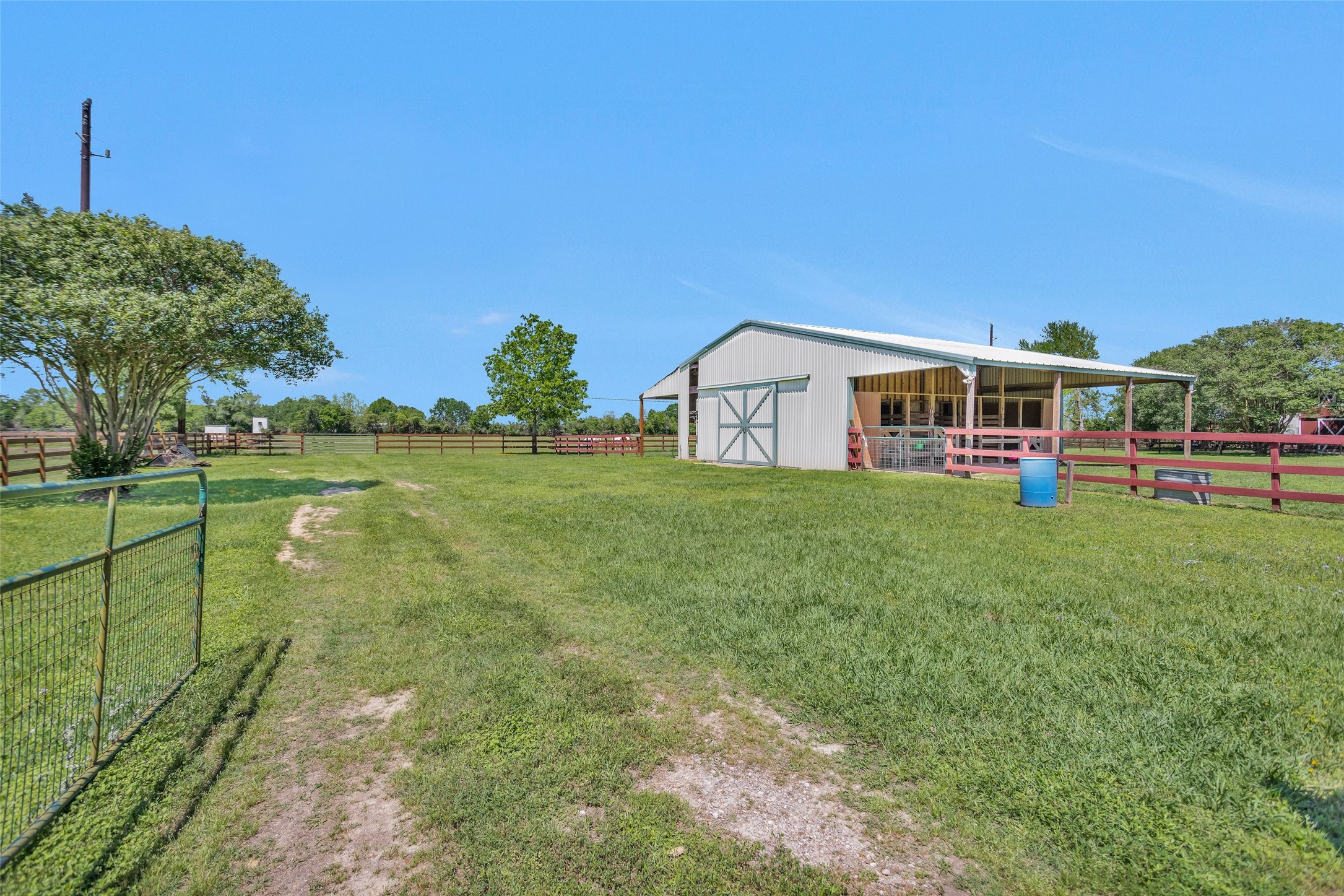 Tbd Walker Lane Fulshear, TX 77406 - Photo 6 of 17 a view of a house with a yard and sitting area