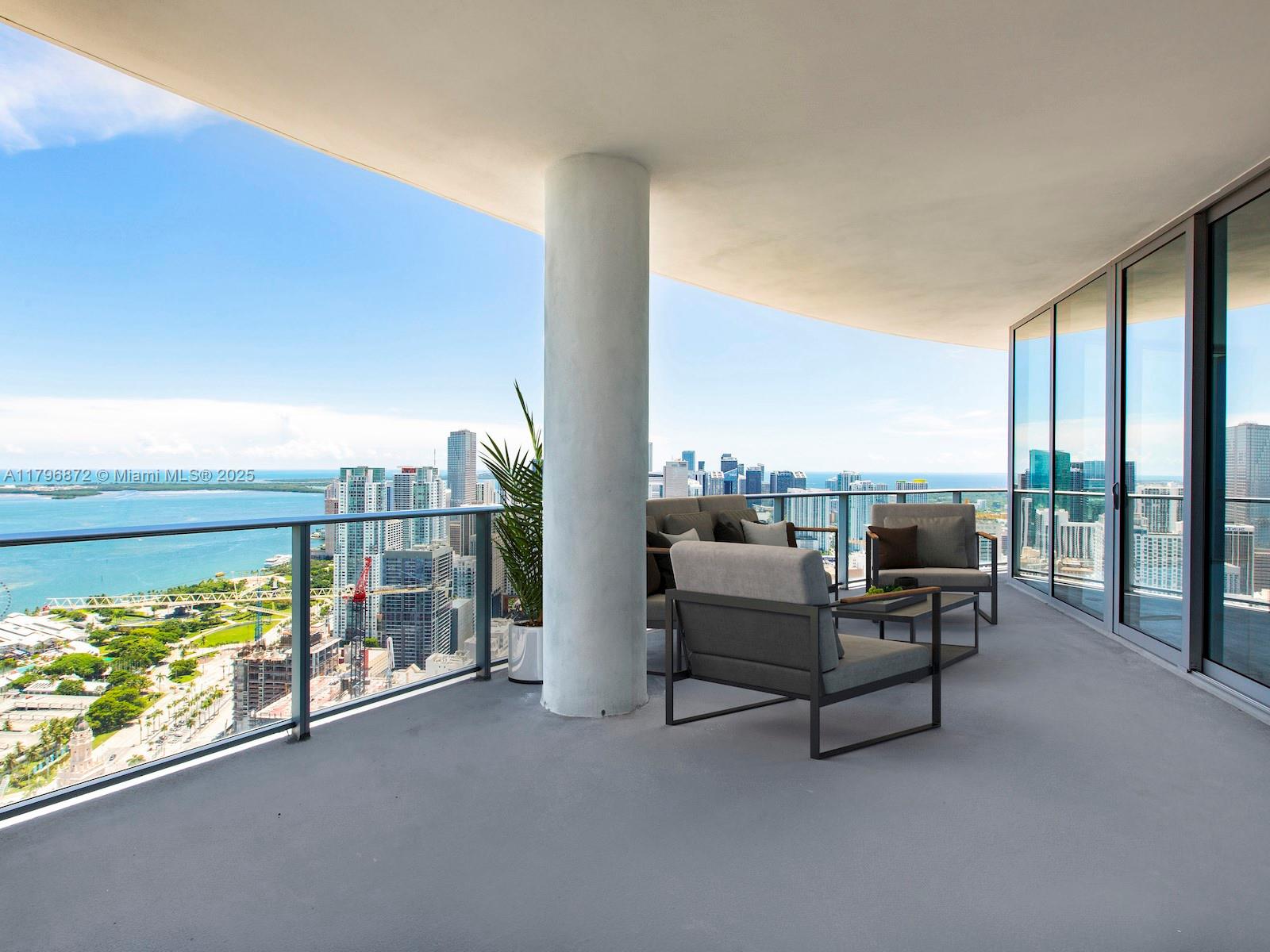 851 Northeast 1st Avenue, Unit PH5011 Miami, FL 33132 - Photo 2 of 35 a balcony with furniture and city view