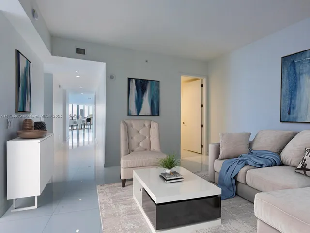 a living room with furniture and a couch