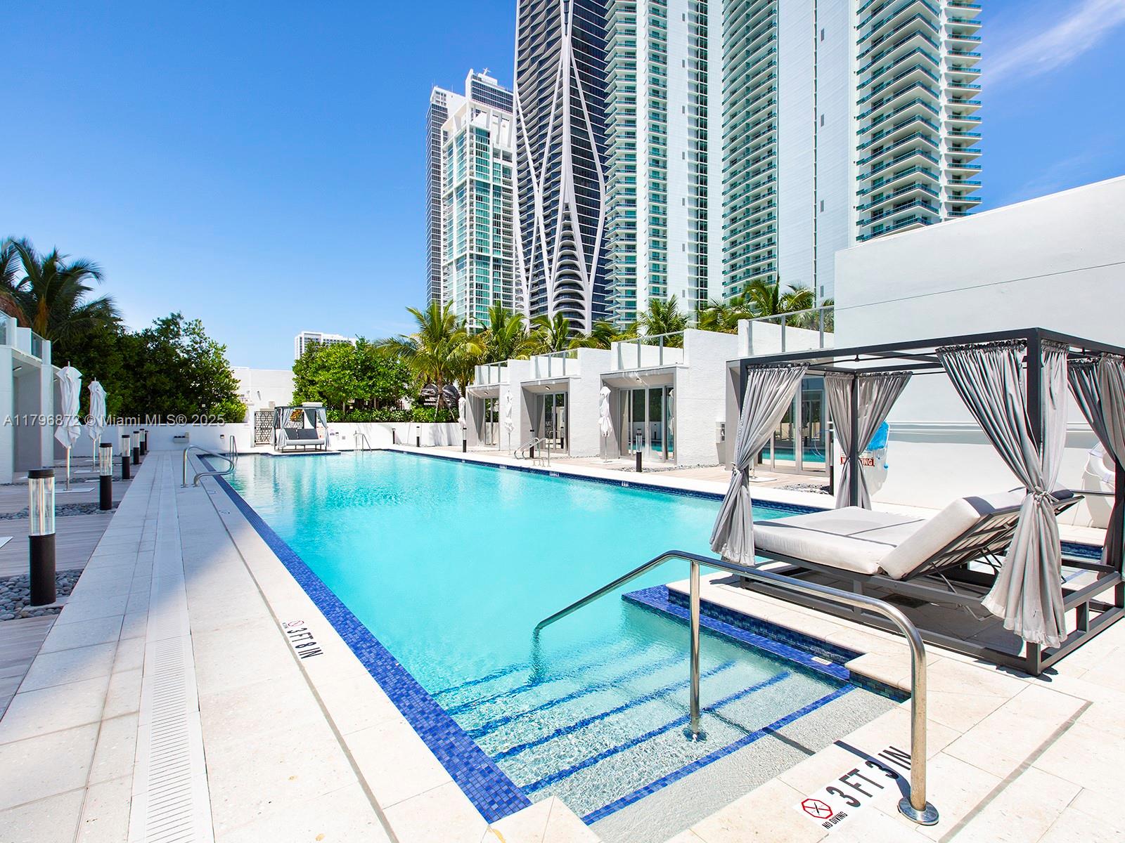 851 Northeast 1st Avenue, Unit PH5011 Miami, FL 33132 - Photo 32 of 35 a view of swimming pool with chairs