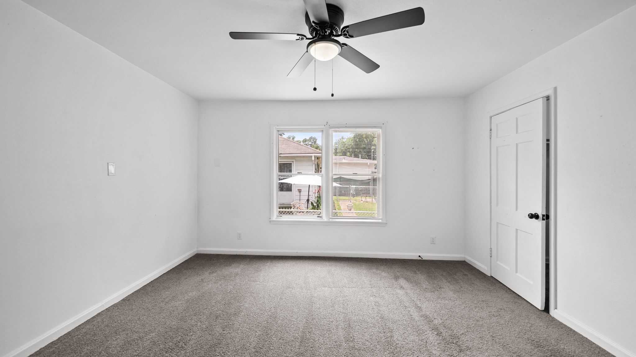 8327 Bonner Drive Houston, TX 77017 - Photo 20 of 37 an empty room with a window and a fan