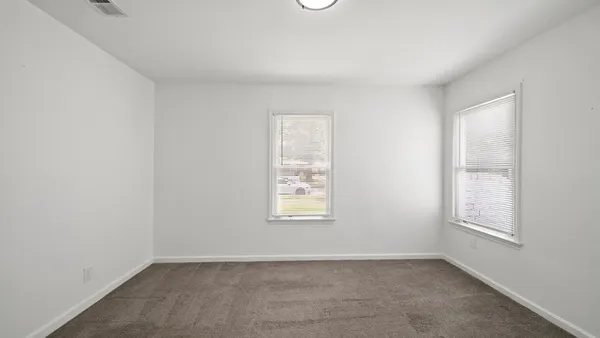 an empty room with windows