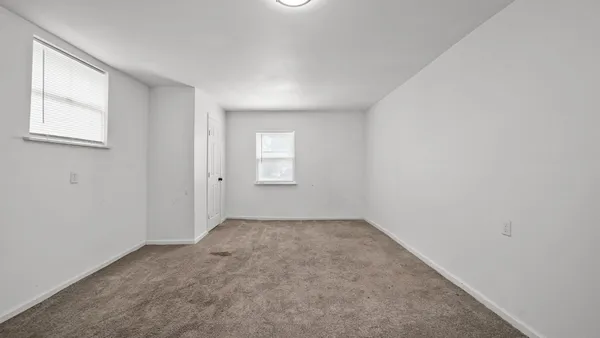 an empty room with windows