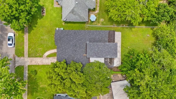 an aerial view of a house with a garden