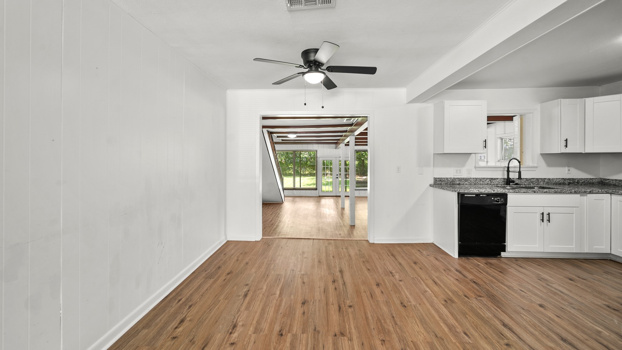 8327 Bonner Drive Houston, TX 77017 - Photo 10 of 37 a view of a kitchen with wooden floor and a ceiling fan