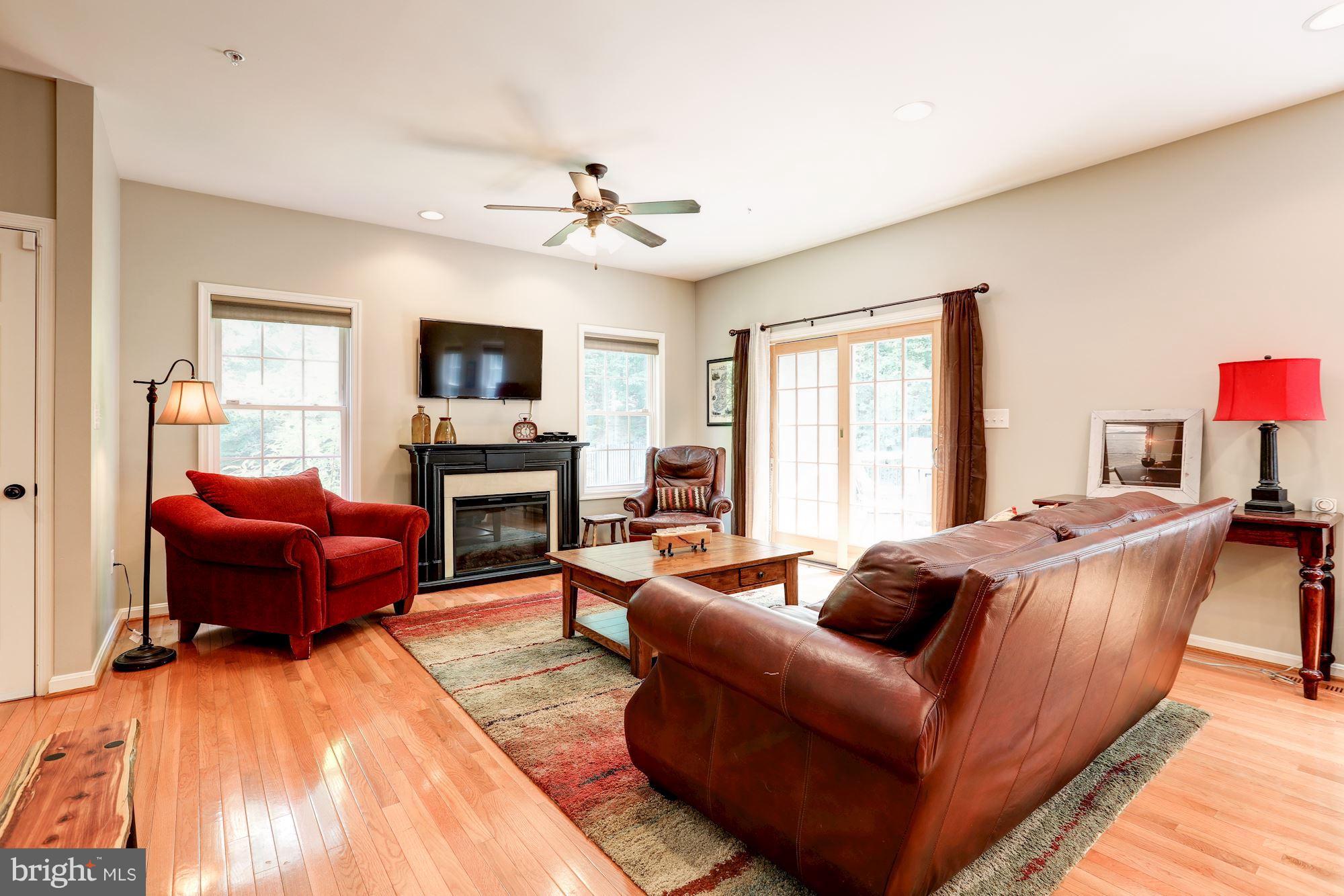 411 Heitzman Road Davidsonville, MD 21035 - Photo 18 of 29 Family room with free standing electric fireplace