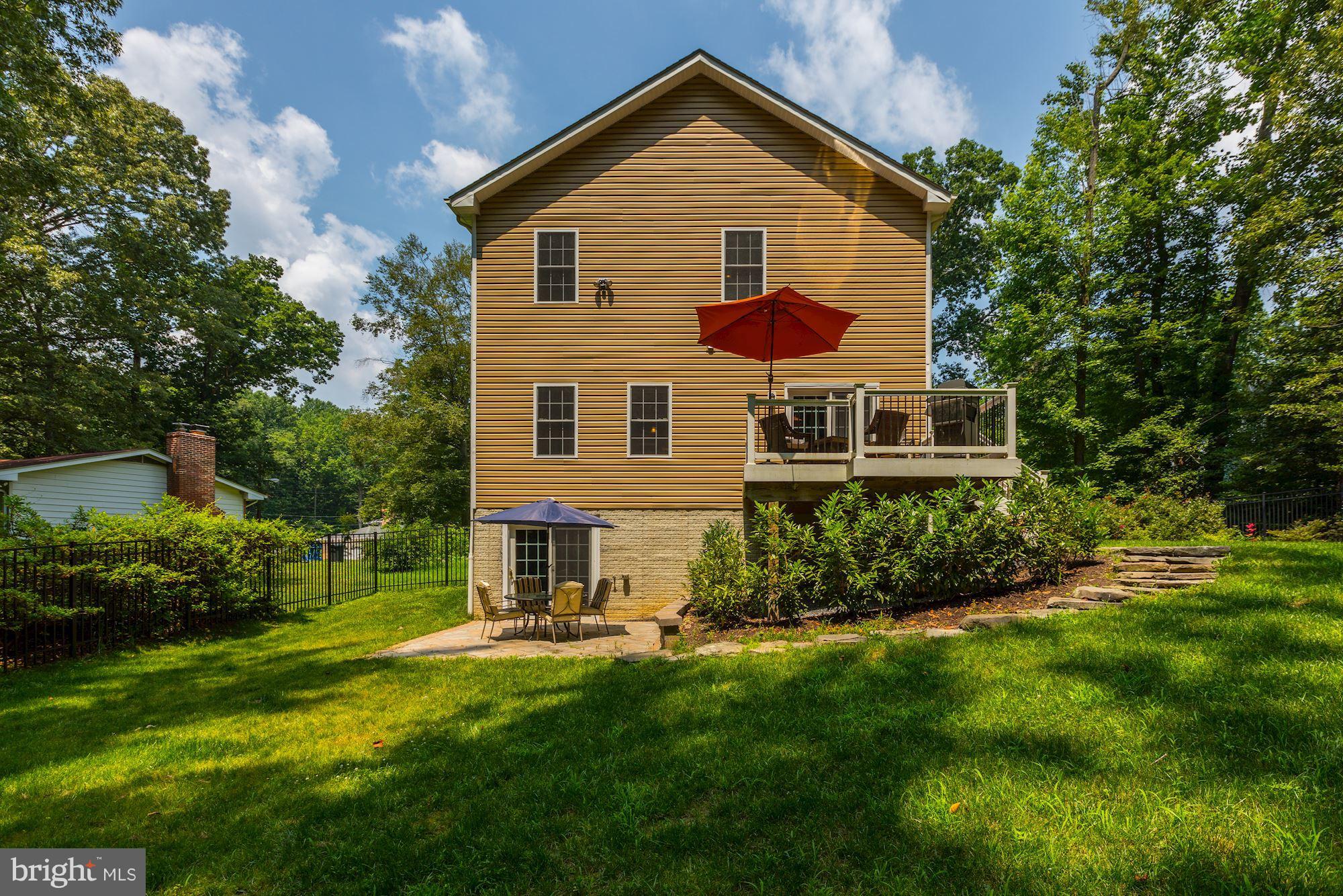 411 Heitzman Road Davidsonville, MD 21035 - Photo 26 of 29 Large fenced back yard with deck and patio
