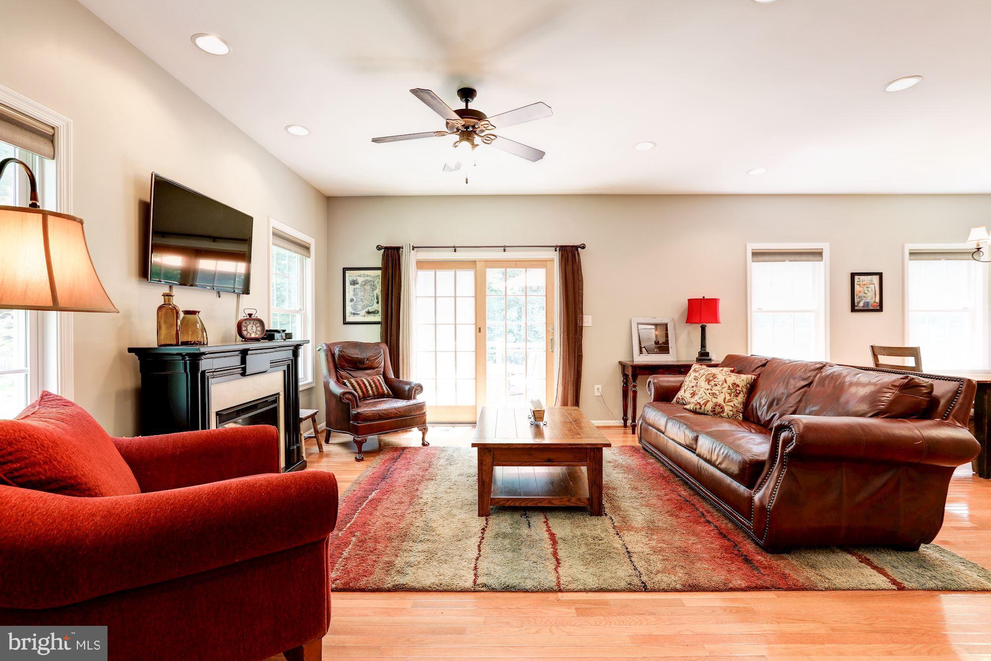 411 Heitzman Road Davidsonville, MD 21035 - Photo 6 of 29 Family Room w/ sliding door giving access to deck