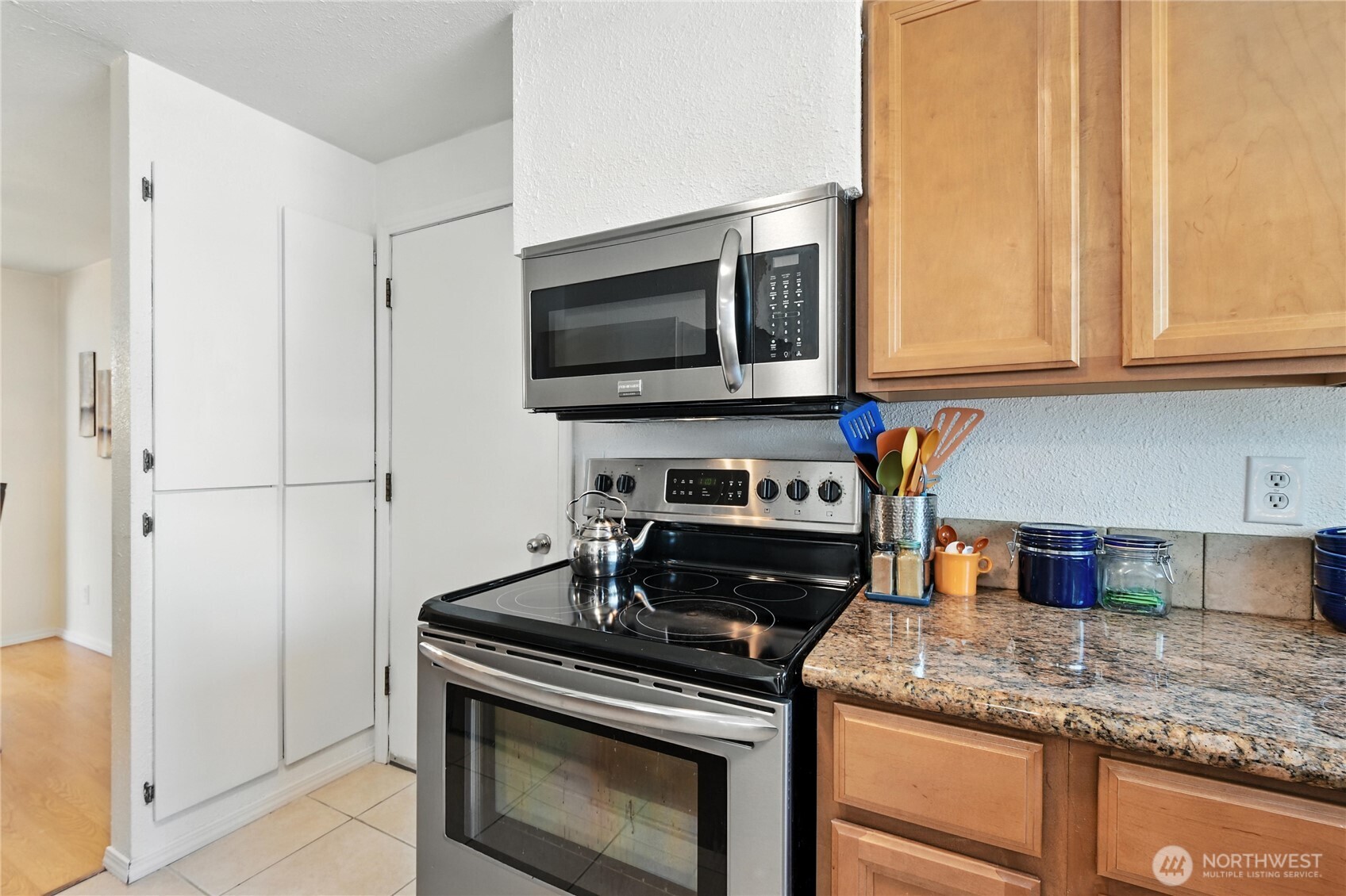 2102 35th Avenue Longview, WA 98632 - Photo 12 of 31 a kitchen with a stove and a microwave