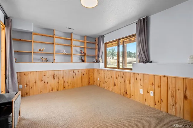 a large white kitchen with a large window