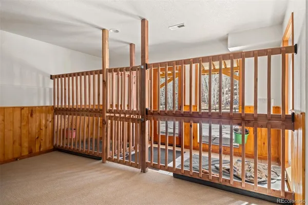 a view of staircase with rug