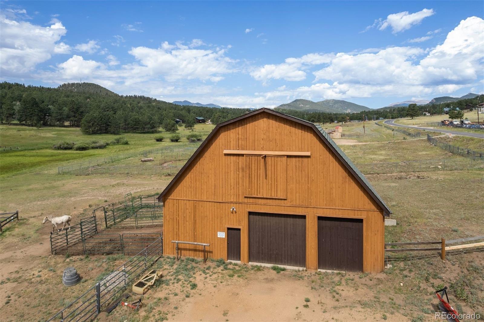 1740 County Road 72 Bailey, CO 80421 - Photo 29 of 40 a view of a terrace with a lake view