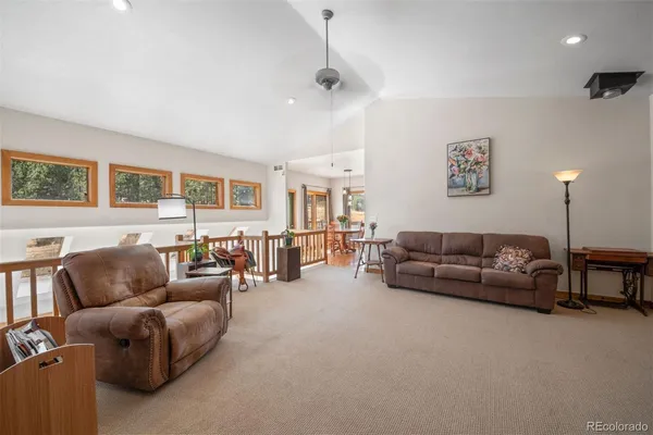 a living room with furniture and a lamp