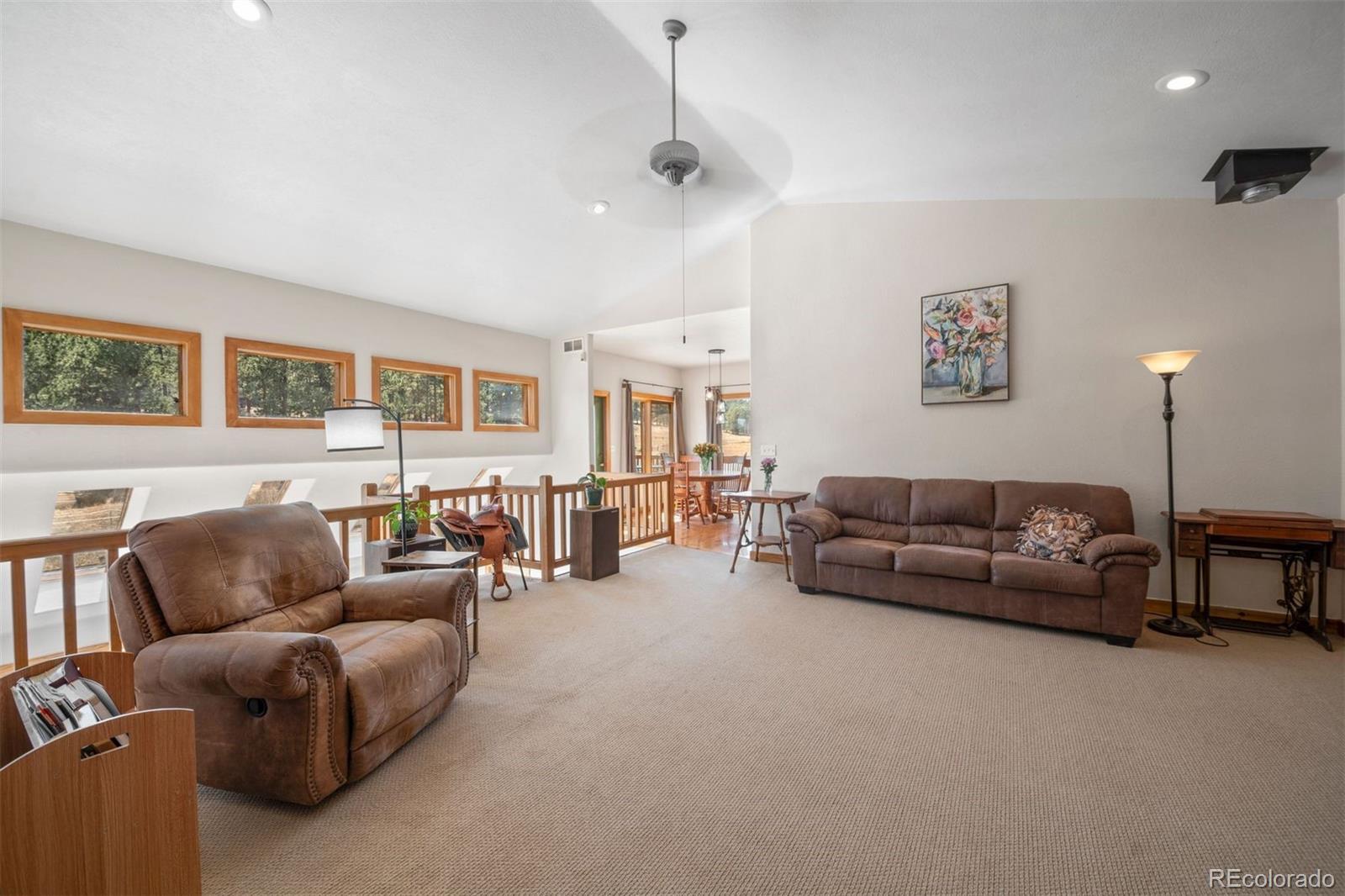 1740 County Road 72 Bailey, CO 80421 - Photo 8 of 40 a living room with furniture and a lamp
