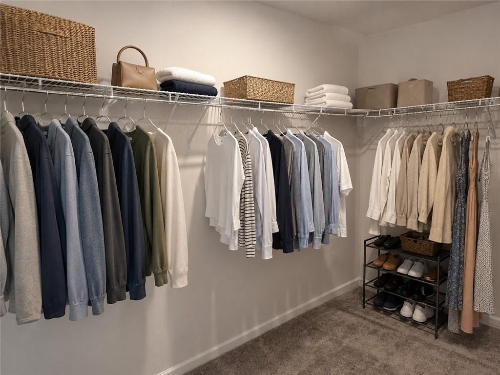 5151 Longview Run Decatur, GA 30035 - Photo 20 of 24 a view of walk in closet with clothes and shoes