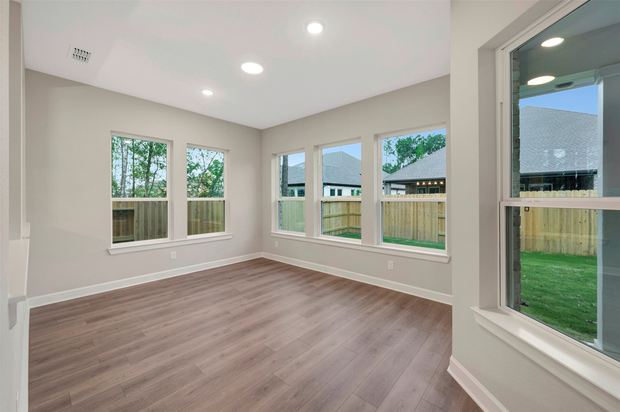 15722 Terracotta Terrace Conroe, TX 77302 - Photo 33 of 50 a view of an empty room with wooden floor and a window