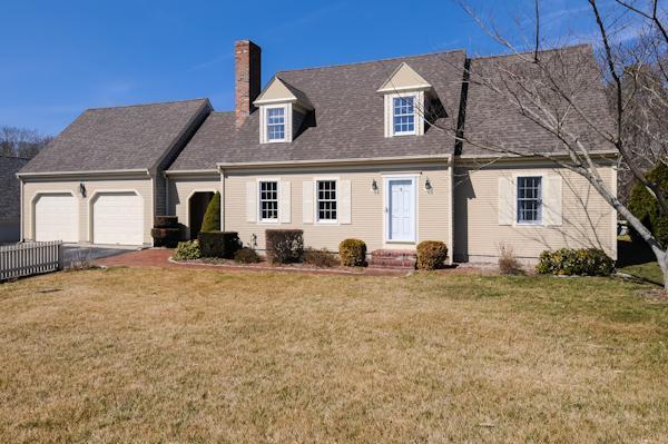 141 Elliott Road Centerville, MA 02632 - Photo 1 of 17 a front view of a house with a yard